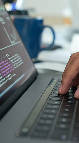 A hand resting on a keyboard.