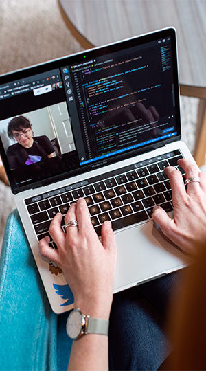 A person working at a laptop.