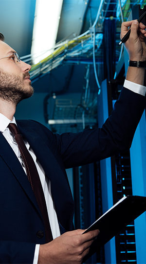 A man inspecting a server.