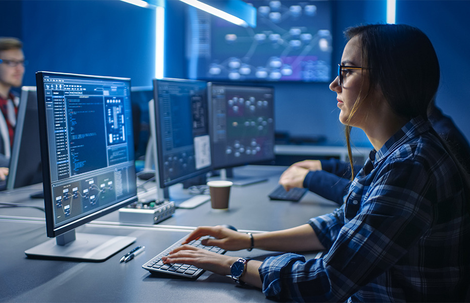 A young woman working at a computer.