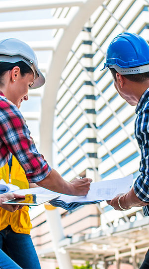 Construction workers filling out paperwork.