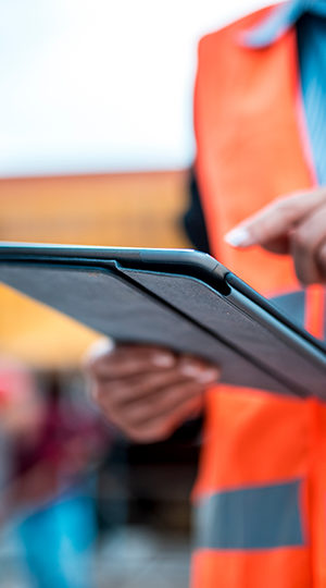 A construction worker using a tablet.