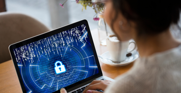 Woman at laptop with lock on her screen.