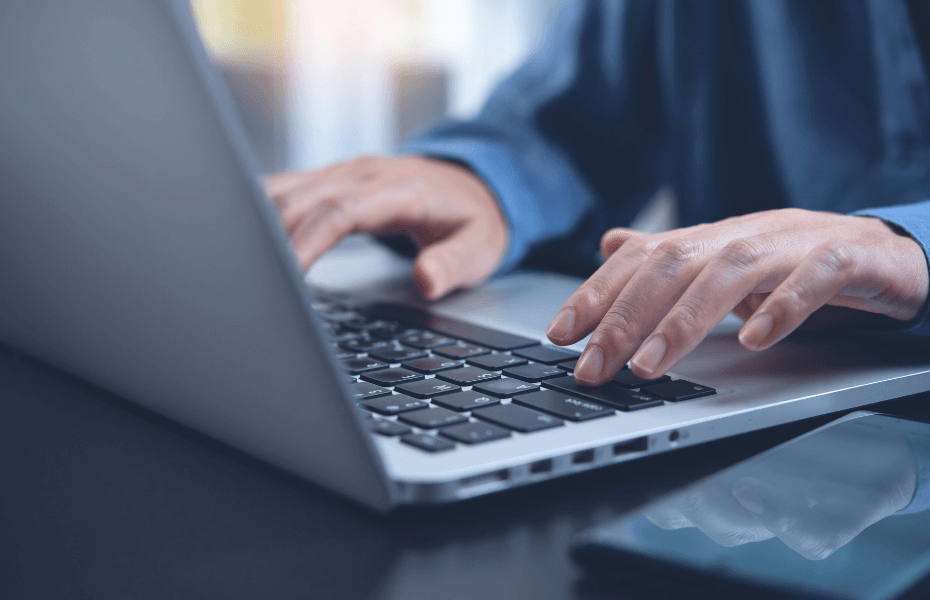 Finance Accounting closeup hands typing on computer keyboard