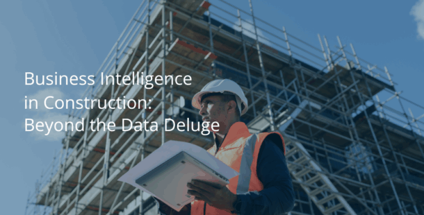 Construction worker in hard hat and high-visibility vest using tablet computer on job site with steel frame building structure and scaffolding in background