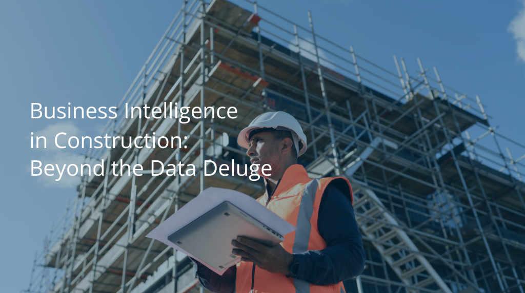 Construction worker in hard hat and high-visibility vest using tablet computer on job site with steel frame building structure and scaffolding in background