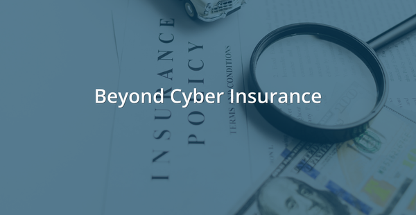 Insurance policy document with a magnifying glass resting on top, alongside a small toy car and U.S. currency, all under a blue-gray overlay. White text reads: Beyond Cyber Insurance.